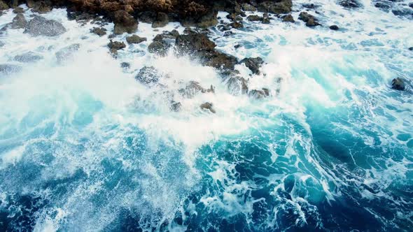 Sea Waves Washes the Rocky Shore Aerial Top View