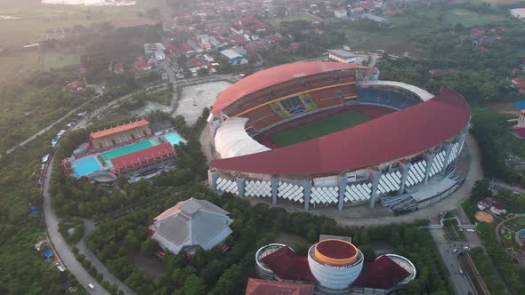 Aerial top down view of the Beautiful scenery of Wibawa Mukti Stadium when sunrise