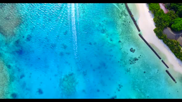 Aerial tourism of beautiful tourist beach journey by blue ocean with white sand background of a dayo