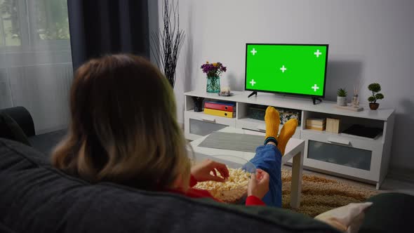Woman Watching Green Chroma Key Screen TV, Relaxing.