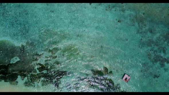 Aerial drone view nature of beautiful seashore beach holiday by blue ocean with white sandy backgrou