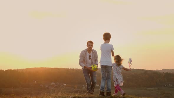 Family Vacation In Nature. Young Family Having Fun.