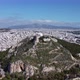 Drone View of Mount Lycabettus Surrounded By the Endless Quarters of Athens - VideoHive Item for Sale