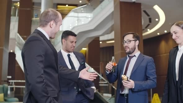 Businessman Having Unhealthy Lunch