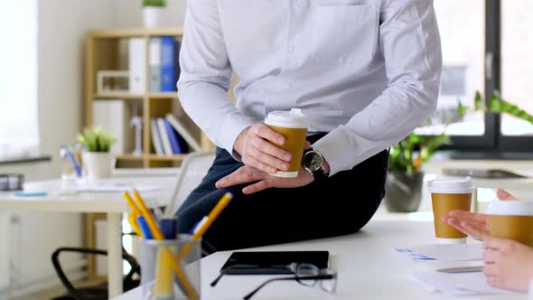 Business Team Drinking Coffee at Office