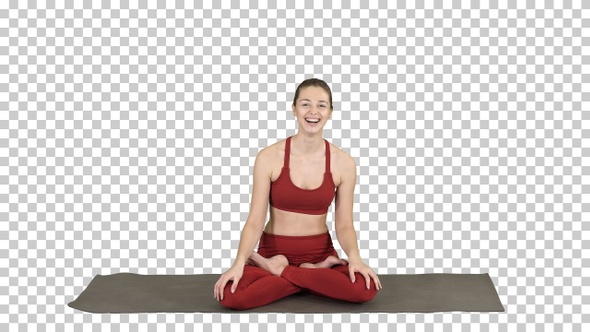 Beautiful Woman Sitting on Yoga Mat and Talking to Someone