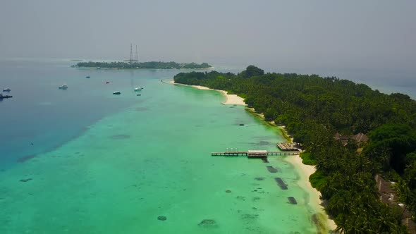 Aerial view travel of seashore beach voyage by blue ocean with sand background