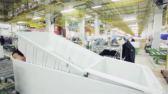 Assembly Line Worker in a Refrigerator Production Line.