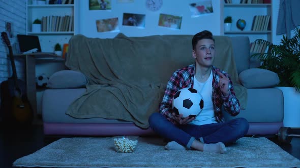 Emotional Student Watching Soccer Match on Tv, National Team Winning Game