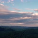Aerial view of morning clouds at sunrise, over hills - VideoHive Item for Sale