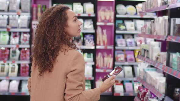 Woman Shopping For Beauty Products With Discount Coupon