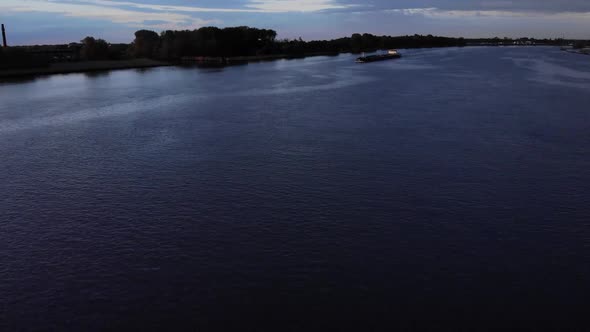 Tranquility Of A River With Oil Tankership Sailing At Dusk Near Barendrecht, Netherlands. - Aerial S