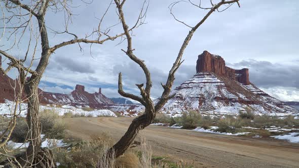 View of desert buttes with snow on them in the Utah landscape