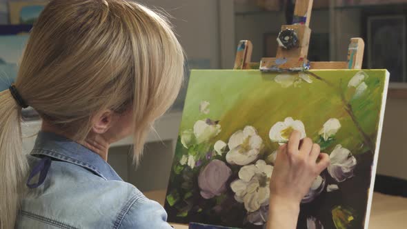 Rear View Female Artist Working on Her Painting at the Art Studio