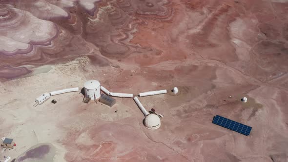 Overhead Research Station with Solar Panels in Red Desert Exploring Planet Mar