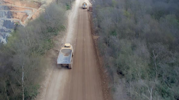 Large Vehicles Working Around a Large Open Quarry