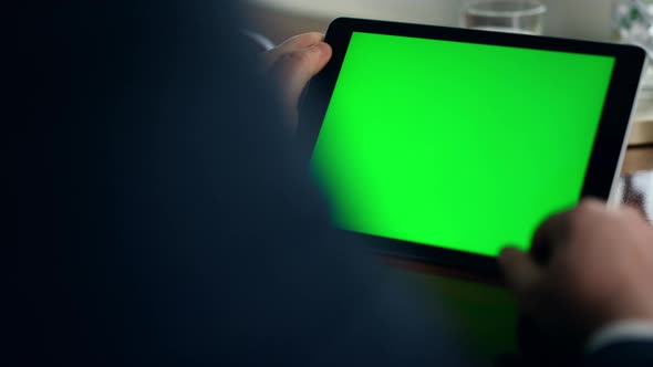 Closeup Green Tablet Screen in Luxury Office