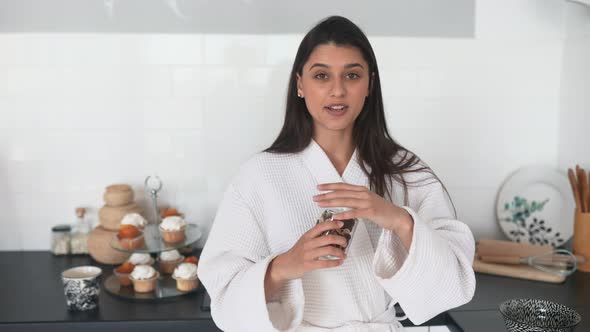 Beautiful Smiling Girl Dressed in White Bathrobe Preparing Breakfast