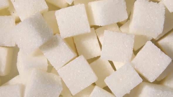 Rotation macro white sugar cubes close up texture background