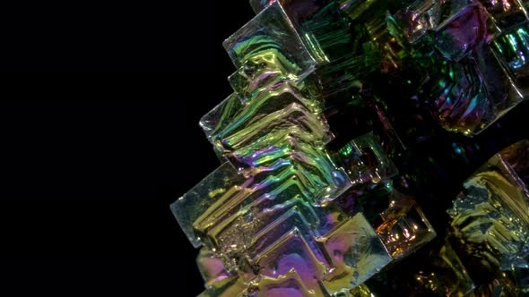 Amazing Colorful Rainbow Bismuth Gemstone Macro Closeup Isolated on Black Background.