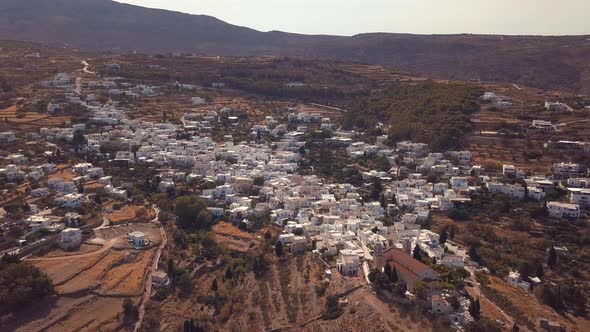 Aerial Drone Shot Coming in from the Backside of the Agricultural Village of Lefkes Greece