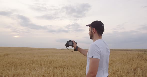 A Young Guy Takes Pictures of Beautiful Landscapes