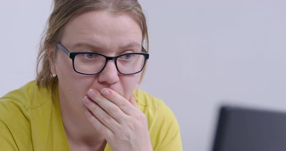 Curvy Woman in Glasses Comes Up with Idea While Working