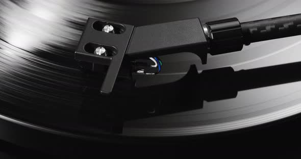 Closeup of Tonearm Headshell Lowering on Spinning Record