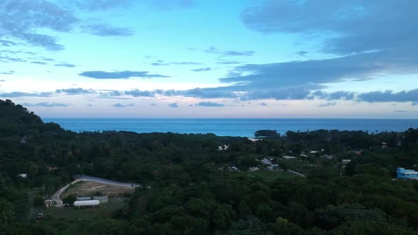 Colorful tropical sunset in the Dominican Republic. Beautiful scene, wide aerial view sweeping from