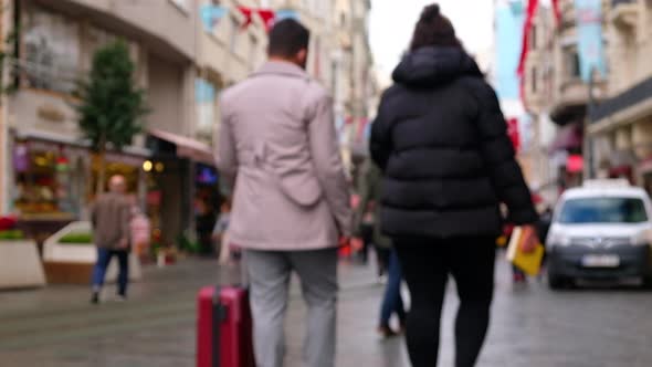 Tourists Walk Down the Street