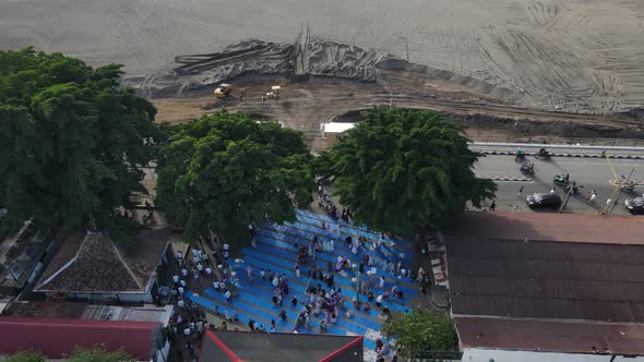 Aerial view, worshipers praying for Eid al-Adha or Eid al-Fitr in the courtyard of the Kauman Mosque