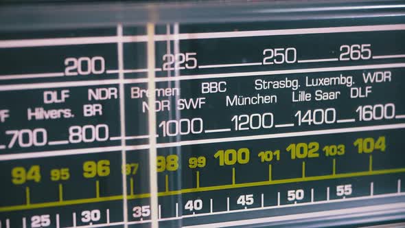 Tuning Analog Radio Dial Frequency on Scale of the Vintage Receiver