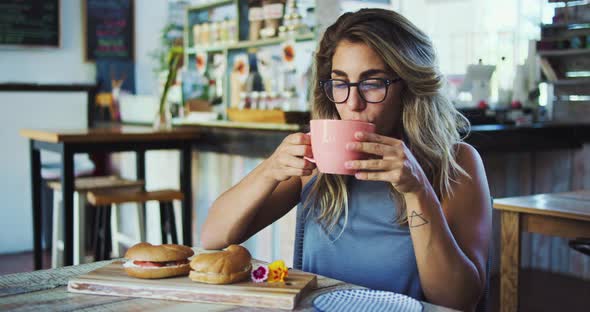 Young Woman Drinking Coffee