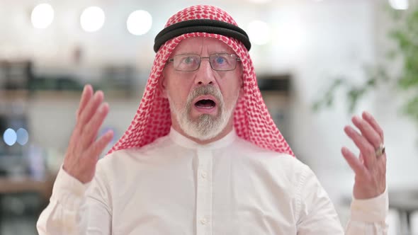 Upset Senior Old Arab Businessman Reacting To Loss, Failure
