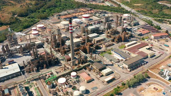 Aerial View. Oil Refinery, Chemical Factory and Power Plant with Many Storage Tanks and Pipelines