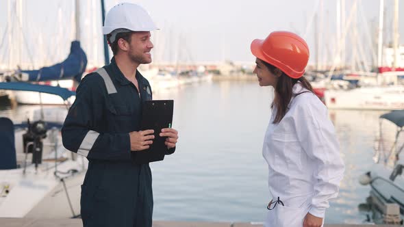 Man Seafarer Meeting with Female Surveyor in Yacht Club