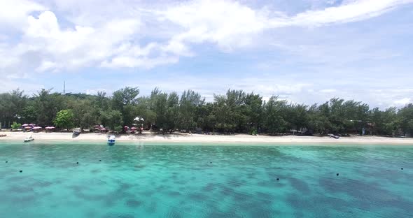 Aerial beach with clear blue water and clear sky