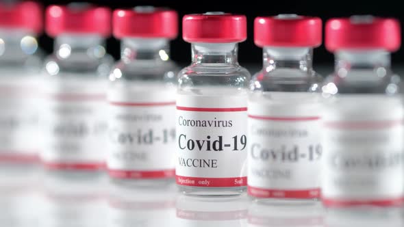 Covid Coronavirus Vaccine Vial on the Table Closeup