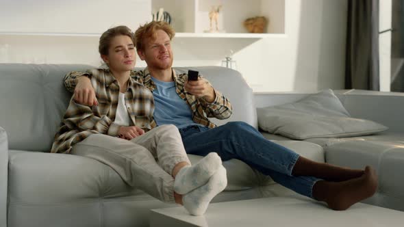 Couple Enjoy Tv Evening on Comfortable Sofa