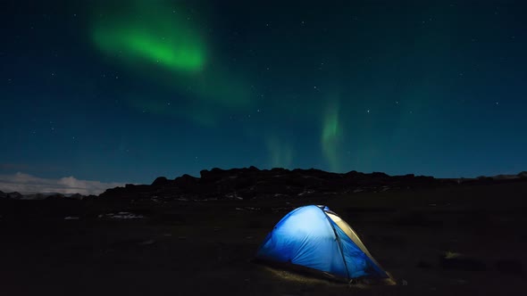 Tourist Tent on the Background of the Northern Lights - Aurora Borealis.