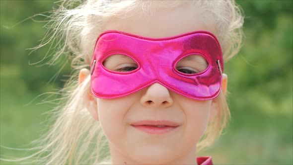 Beautiful Llittle Girl in the Superhero Costume, Close Up Portrait Child in the Mask of the Hero