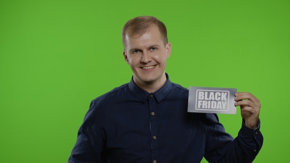 Joyful Man Showing Black Friday Inscription Note, Smiling Looking Satisfied with Low Prices