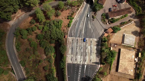 Aerial View of Cars Entering a Tunnel