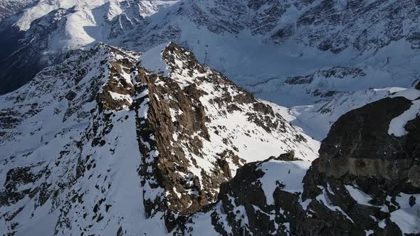 Aerial View of Cheget Mountain Range in Snow in Winter in Sunny Clear Weather