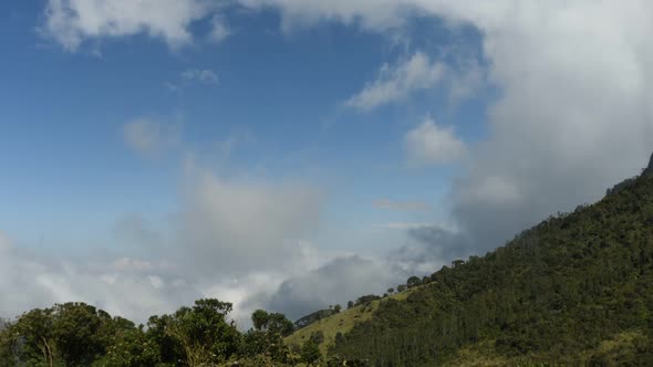 Time lapse of clouds moving over mountainside