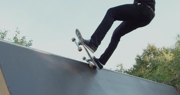 Young adult skateboarding halfpipe 4k super slow motion