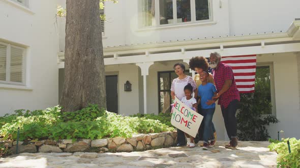 African American man coming back home with his family