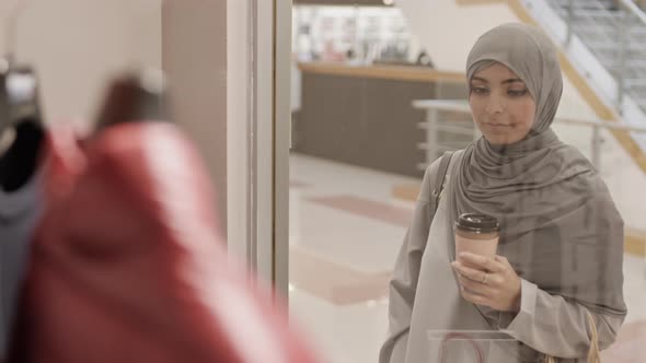 Young Muslim Woman Shopping in Mall