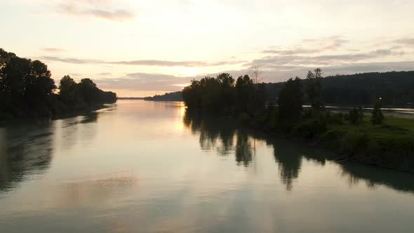 View of Fraser River. Colorful Summer Sunset. East of Vancouver, British Columbia, Canada.