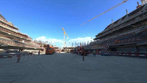 Motion Through Dust to Sports Stadium Construction Site